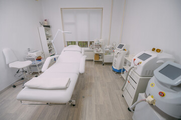 The interior of the massage and cometology salon, massage table. Nobody.