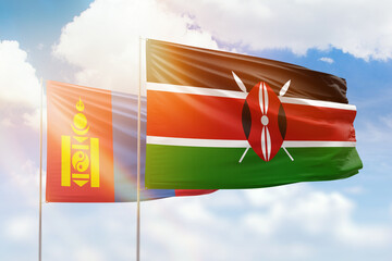 Sunny blue sky and flags of kenya and mongolia