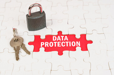 Poster - On puzzles there is a lock and keys, on a red surface there is an inscription - Data protection