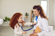 © Studio Romantic - Little girl child use stethoscope listen to female doctor heart feel playful at appointment in hospital. Excited kid play with caring woman pediatrician in clinic. Children healthcare and medicine.