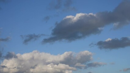 Wall Mural - 4k scenic video time-lapse of beautiful sunny sunset cloudy cloudscape. white and grey fluffy clouds