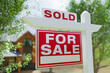 Sold For Sale Real Estate Sign In Front of Property.