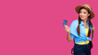 © khmelev - Mockup or template advertisement. Woman holding credit card on isolate pink background. Female wearing straw hat and casual clothes