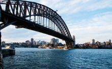 Small Yacht Sailing Under Sydney Harbour Bridge