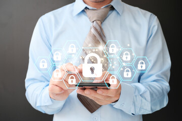 Poster - Businessman uses a smartphone padlock to protect business and information data via a virtual network connection. Innovation technology creates smart solutions to protect against digital attacks.