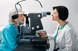 Senior woman getting eye exam at ophthalmology clinic with optometrist. Ophthalmology for older people