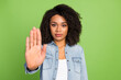 © Tetiana - Photo of young lady show arm no stop rejection enough forbidden symbol isolated over green color background
