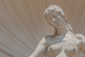 Wall Mural - Old sculpture of a sensual woman nymph bathing at the fountain in Zwinger gardens at historical and museums downtown of Dresden, Germany.