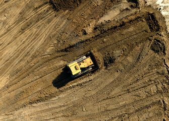 Wall Mural - Bulldozer at mine reclamation once mining sand is completed. Land clearing, grading, pool excavation, utility trenching. Dozer during Road construction on construction site.