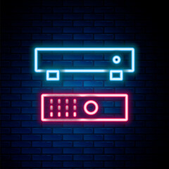 Poster - Glowing neon line Multimedia and TV box receiver and player with remote controller icon isolated on brick wall background. Colorful outline concept. Vector