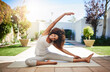 Im reaching for my fitness goals. Are you. Full length portrait of a sporty young woman practicing yoga outdoors.