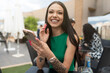 © Antonio Recena - smiling woman at phone in real site