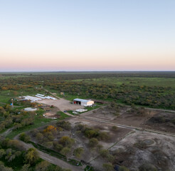 Wall Mural - Typical farm in the province of buenos aires. Aerial view of a farm with a corral for cows.