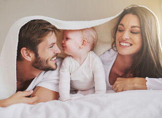 Wall Mural - Shes daddys little girl. Cropped shot of a young couple and their baby daughter in the bedroom.