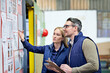© Yuri Arcurs/peopleimages.com - This all needs updating. Cropped shot of a two coworkers managing a warehouse.