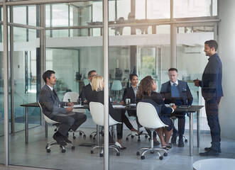 Poster - The business place to be. Shot of businesspeople having a meeting in the office.