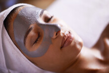 Nourishing Her Skin With A Facial Treatment. A Young Woman Relaxing During A Facial Treatment At A Spa.