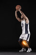 © Ashiq J/peopleimages.com - Play through the pain. Studio shot of a handsome young basketball player with an inflamed knee.