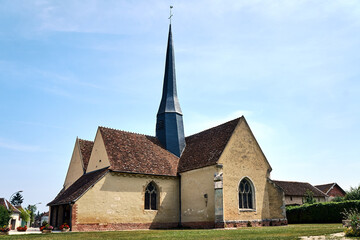 Wall Mural - stone medieval church with a bell tower in Champagne