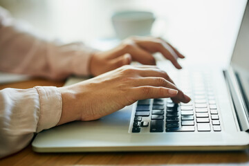 Poster - planning for big success. closeup shot of an unidentifiable businesswoman using a laptop in an offic