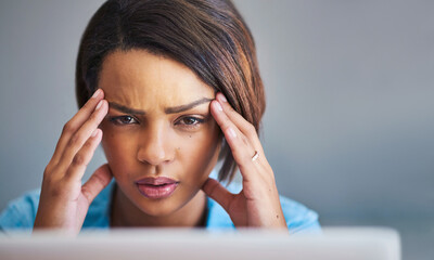 Poster - I seriously need a timeout. Shot of an attractive young woman experiencing stress while using a laptop at home.