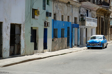 Wall Mural - blue old classic car in the streets of havana