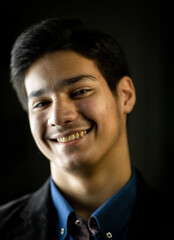 Wall Mural - Portrait of real happy mixed race teenager smiling. High quality photo