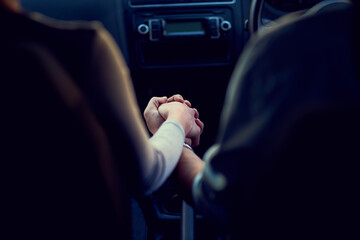 Sticker - Getting away from everything but each other. Rearview shot of a unrecognizable couple holding hands while driving in a car.