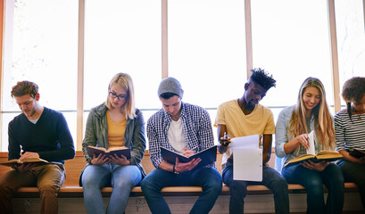 Poster - Final exams are coming up soon. Shot of a group of university students studying at campus.