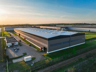 Poster - Pictures from the drone on the warehouse building. Concept for storing goods, shipping for stores, ecommerce, online stores. Aerial view on warehouses.
