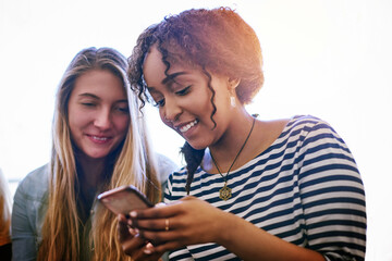 Poster - Theres wifi all around campus. Shot of two university students using a cellphone at campus.