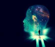 Open Your Mind The The Wonders Of The Universe. Illustration Of A Man Walking Towards A Huge Shape Of A Persons Head Overlaid With An Image Of The Cosmos.