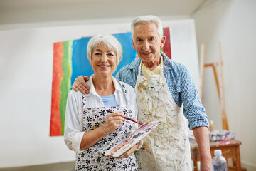 Canvas Print - Love is the spirit that motivates the artists journey. Shot of a senior couple painting at home.