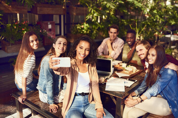Aufkleber - Im just here for the selfies. Cropped shot of an attractive young woman taking a selfie while out for lunch with friends.