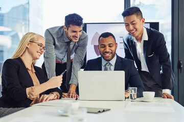 Poster - Get the team together and get it done. Shot of a group of young businesspeople using a laptop during a meeting in the boardroom of a modern office.