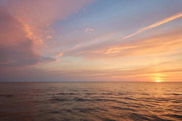 Wall Mural - Baltic sea. Dramatic sunset sky, glowing pink and golden storm clouds, midnight sun. Picturesque panoramic aerial view. Nature, environment, ecology. Purity, tranquility, relaxation concepts