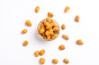 Fried coated peanuts on white background. Delicious snack peanut.