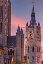 Bell Tower Of The Saint Nicolas Church At Night In The Historic Center Of Ghent, Belgium