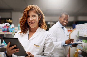 Poster - Were open 24 hours for your convenience. Portrait of two pharmacists working together in a chemist.