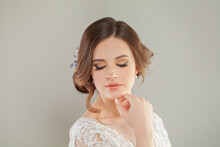 Wedding Style. Beautiful Young Bride With Luxury Wedding Hairstyle And Natural Fresh Makeup Portrait