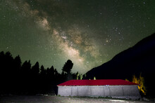 Milky Way Stars With Light Painting On Red Building In Four Ground