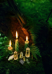 Minerals, amulet and candles in mysterious forest, dark natural background. Witchcraft, Esoteric spiritual practice. wiccan modern magic. Crystal Ritual for life balance, cleansing aura, soul calming