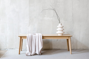 Wall Mural - Ceramic vase with branches and towel on wooden table