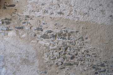 beautiful vintage texture of the wall of a medieval castle built in the middle of the 14th century, multi-colored volumetric stones for the designer, wallpaper, background