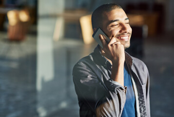 Aufkleber - Talking to a client. Cropped shot of a young businessman talking on his mobile phone.