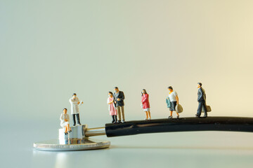 miniature doctor and people with mask on black stethoscope on white ground to solution for Annual Health Check up.