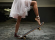 I have many talents. A cropped image of a woman on a skateboard wearing one sneakers and a ballet slipper.