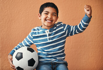 Sticker - When Im big, Im gonna be a soccer star. Portrait of an adorable little boy posing with a soccer ball.