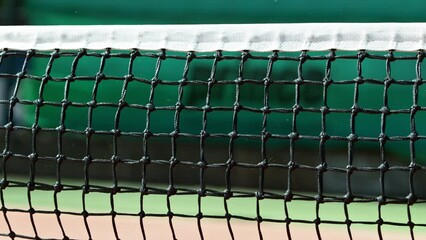 Super slow motion of hitting tennis ball into a net. Low depth of focus. Filmed on high speed cinema camera, 1000fps.