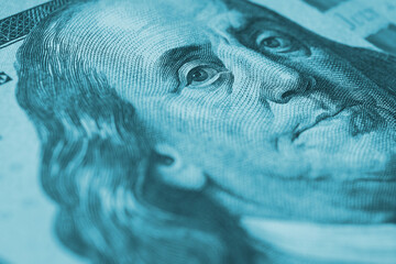 Wall Mural - american paper money. a $100 bill with focus on eyes of benjamin franklin. business economy and the 